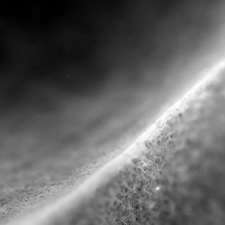 Macro photograph of dust and skin texture across the surface of a breast, blending body and environment